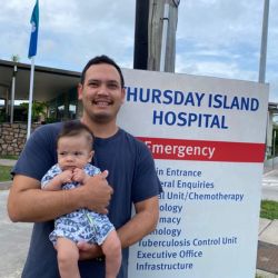 dr cardelli outside thursday island hospital with his first child
